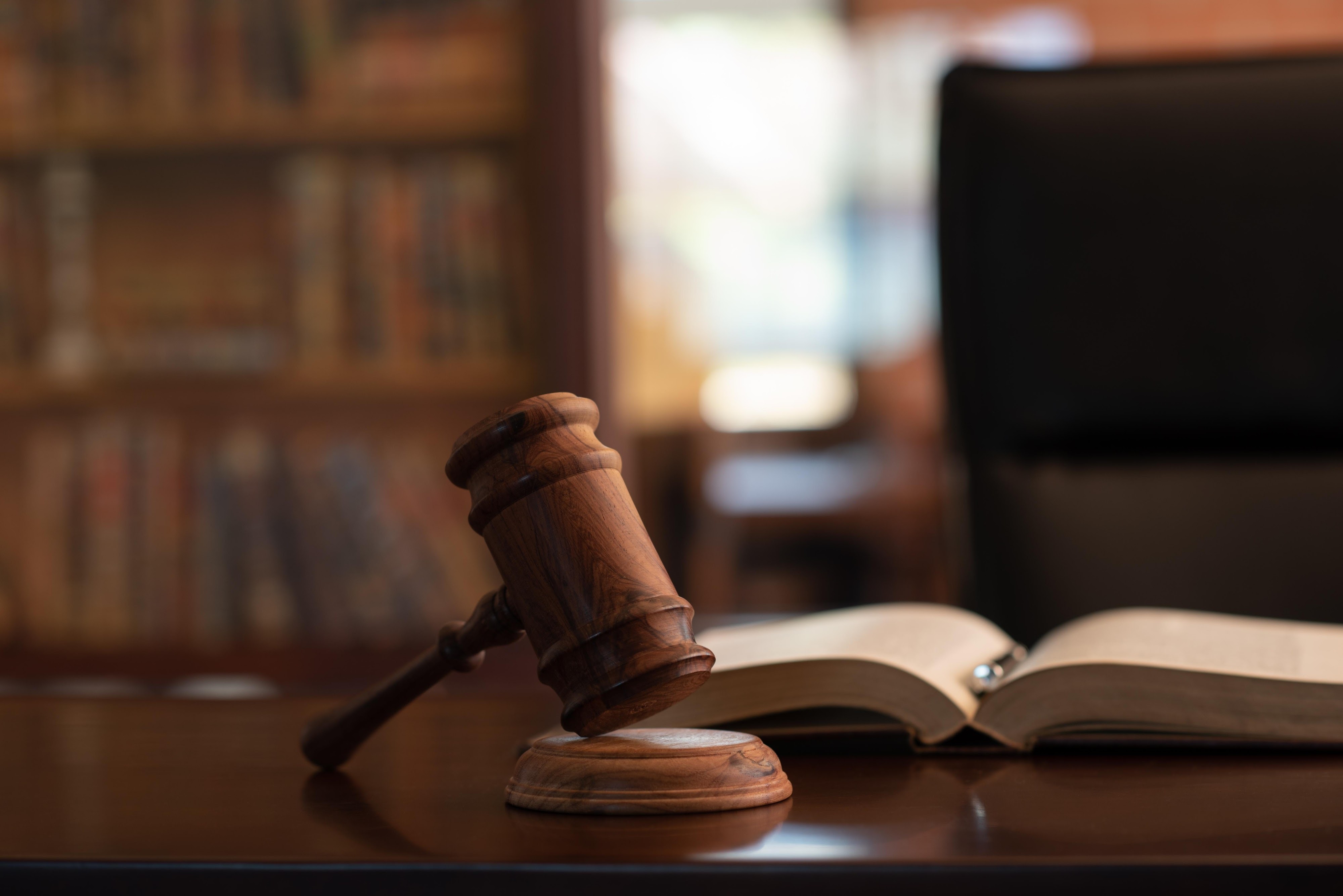 A female police officer professionally interacting with a woman, ensuring safety and respect.